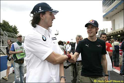 Роберт Кубица (слева) и Себастьян Феттель в Сан-Паулу